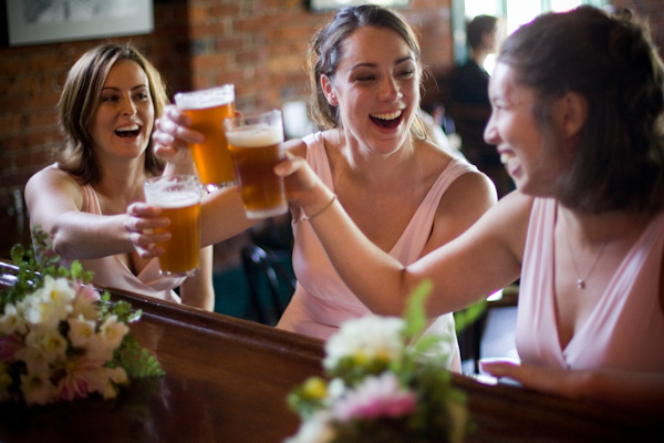 Bridesmaids having a beer at the reception - wedding photo by J Garner Photographer